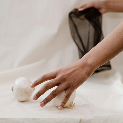 Half a baked onion wrapped in a cloth, a natural remedy for earache relief.