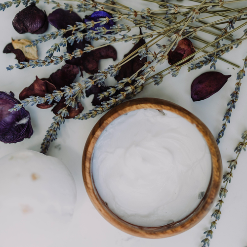 Small bowl of yogurt and honey being mixed, a natural remedy for fighting acne.